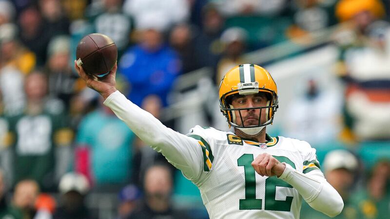 Green Bay Packers quarterback Aaron Rodgers (12) passes during the first half of an NFL...