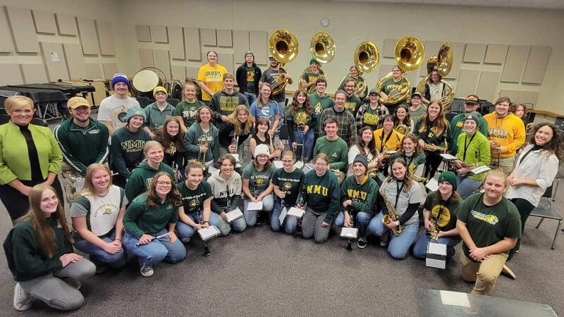 Dr. Stephen Grugin and the NMU Marching Band join Elizabeth Peterson and Tia Trudgeon on Upper...