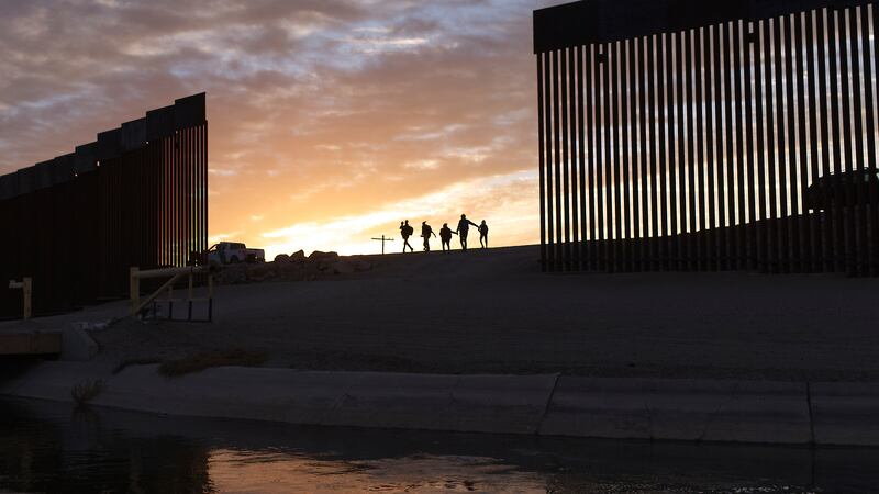 FILE - In this Thursday, June 10, 2021, file photo, a pair of migrant families from Brazil...
