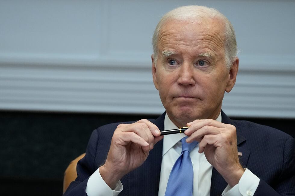 FILE - President Joe Biden pauses after answering a question about the auto workers strike as...