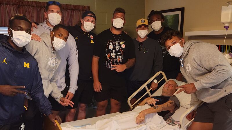Members of the Michigan Wolverines football team visited Bob Gamelin at MediLodge of Munising,...