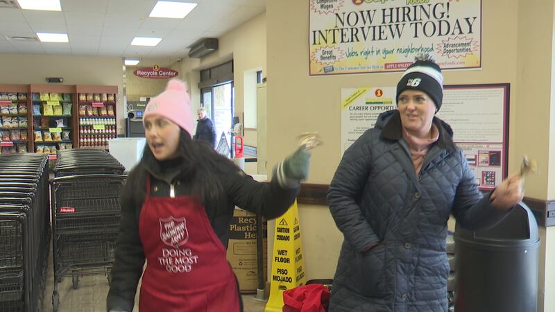 Tia and Elizabeth ring bells for the Salvation Army