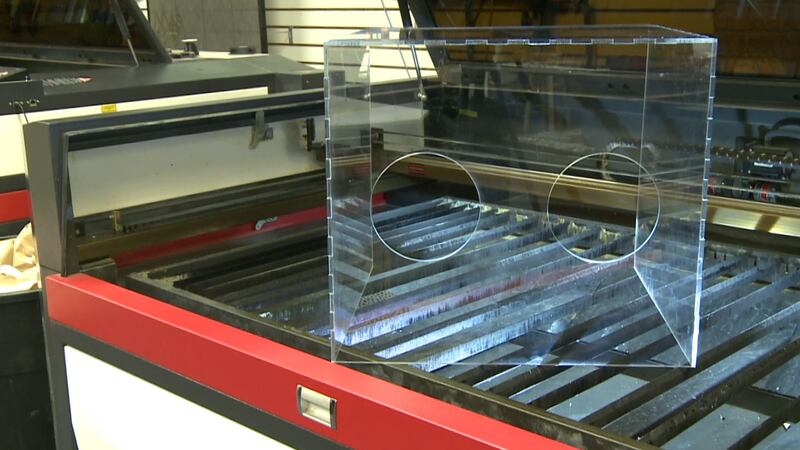 The box acts as a barrier between the healthcare worker and the patient so that while the...
