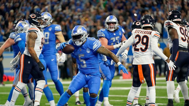 Detroit Lions running back David Montgomery (5) runs in the endzone after his 1-yard rushing...