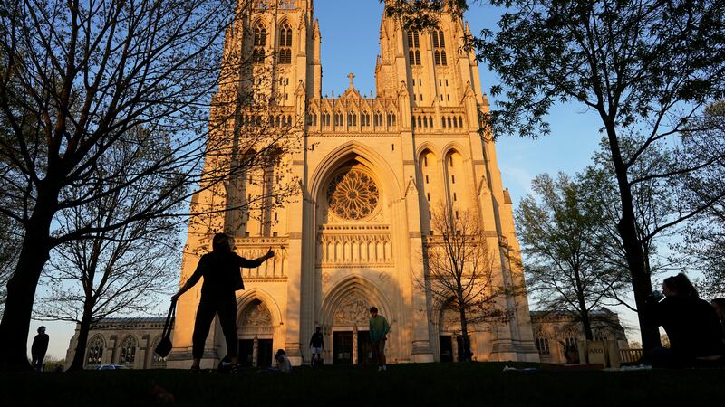 FILE - The Washington National Cathedral is seen at sunset, April 13, 2021, in Washington. The...