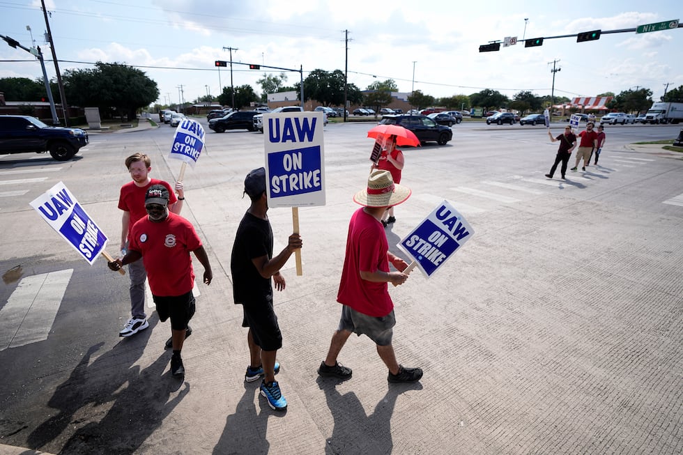 FILE - UAW union members picket on the street in front of a Stellantis distribution center,...